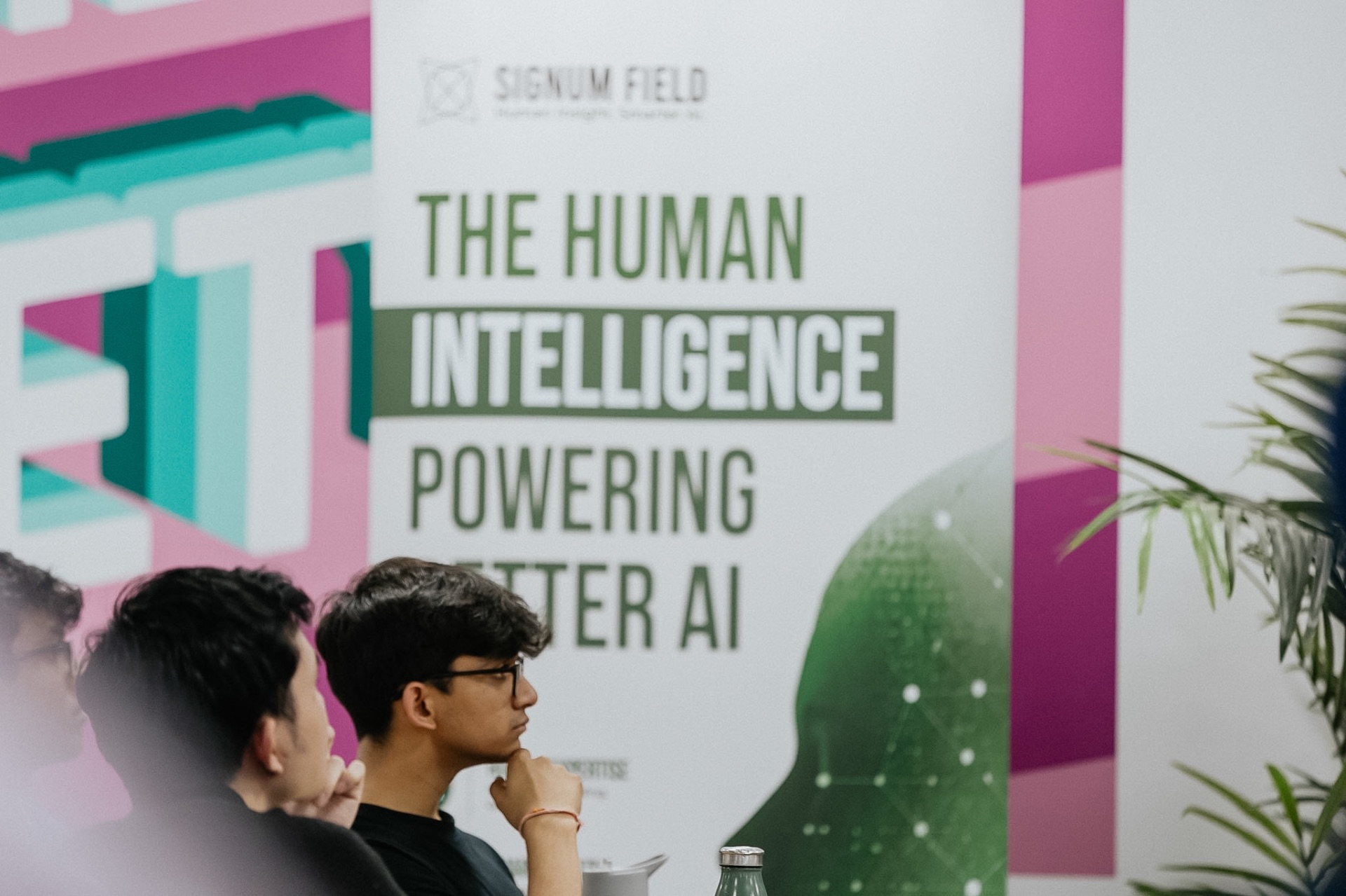 Professionals exchanging ideas at a Signum Field event